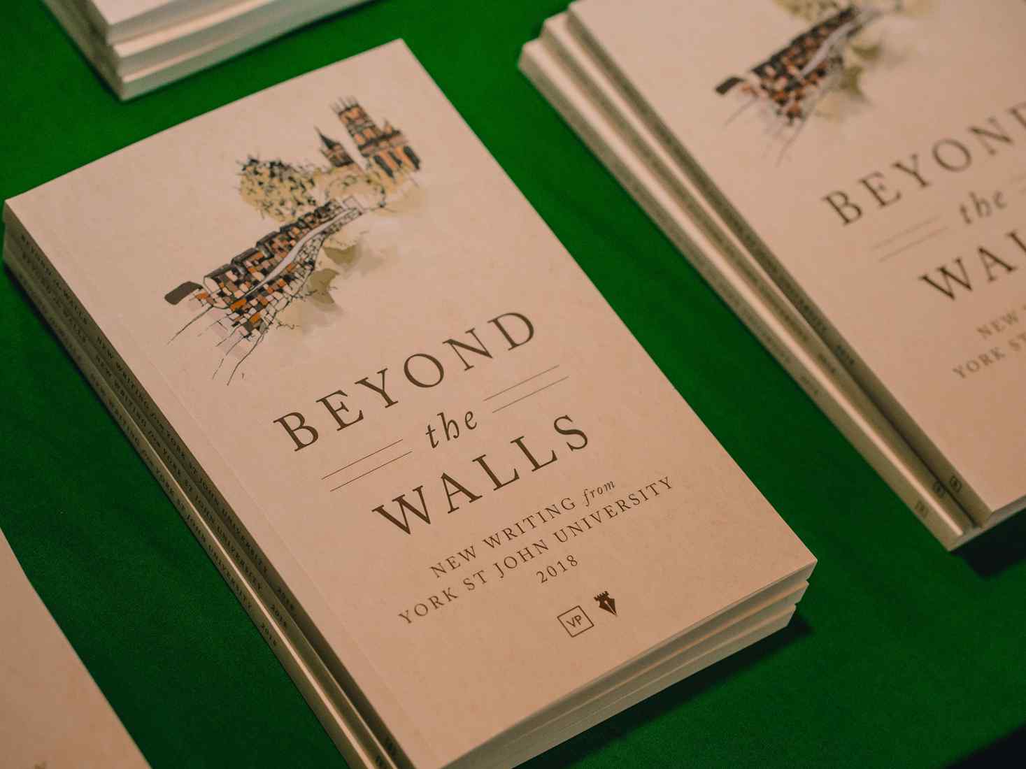 Close up of Beyond the Walls book, an anthology of creative writing from York St John. 