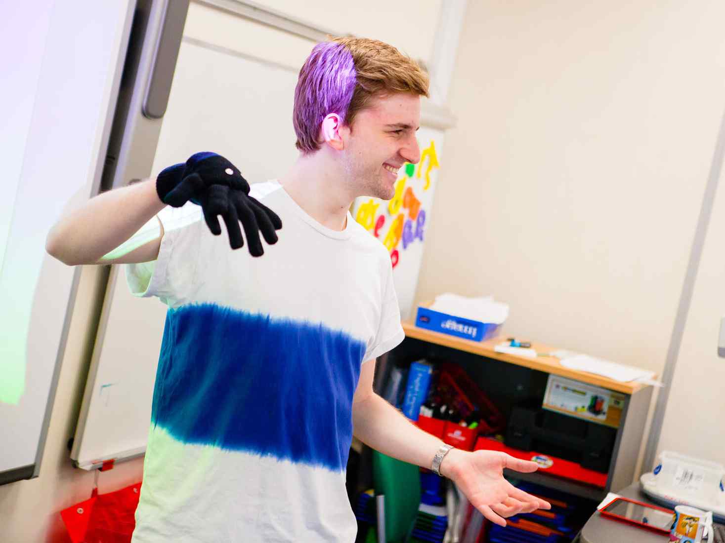 Student using hand puppet 