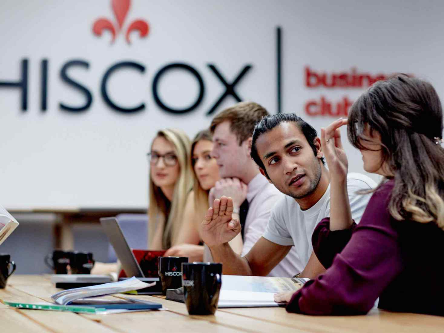 Students conversing at Hiscox 