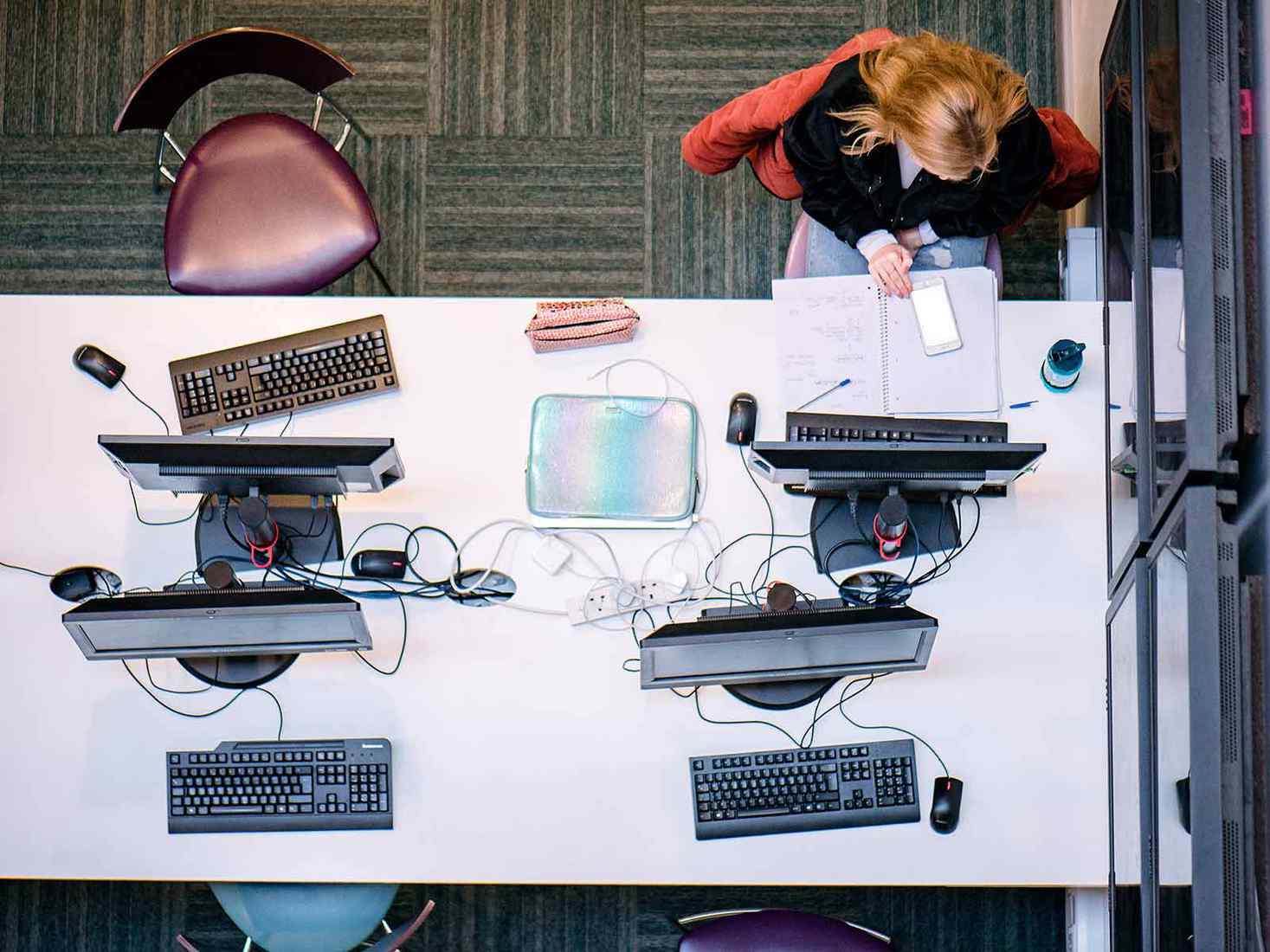 birds eye view of the computers and students heads with work 
