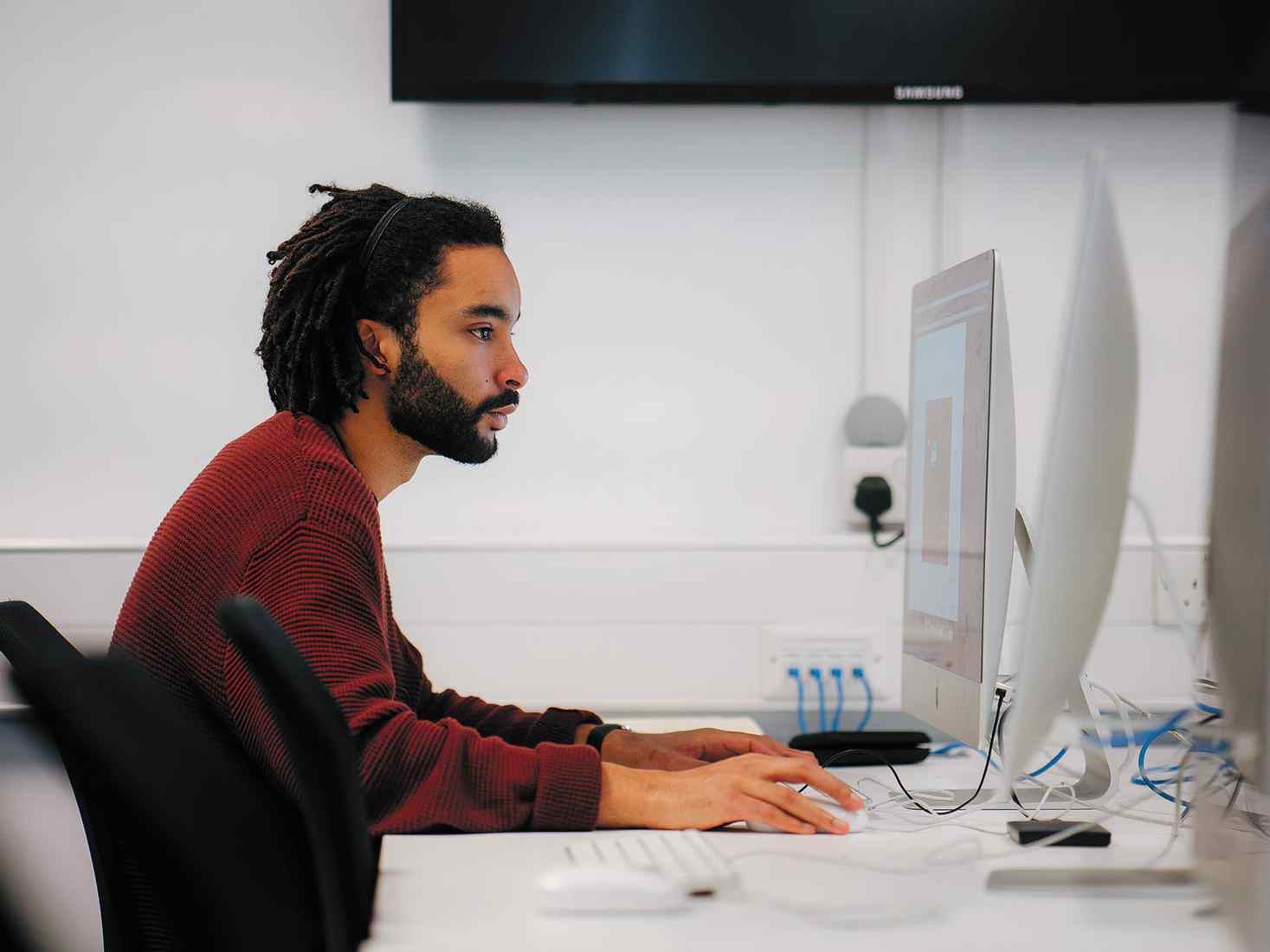 Student working at a desktop computer. 