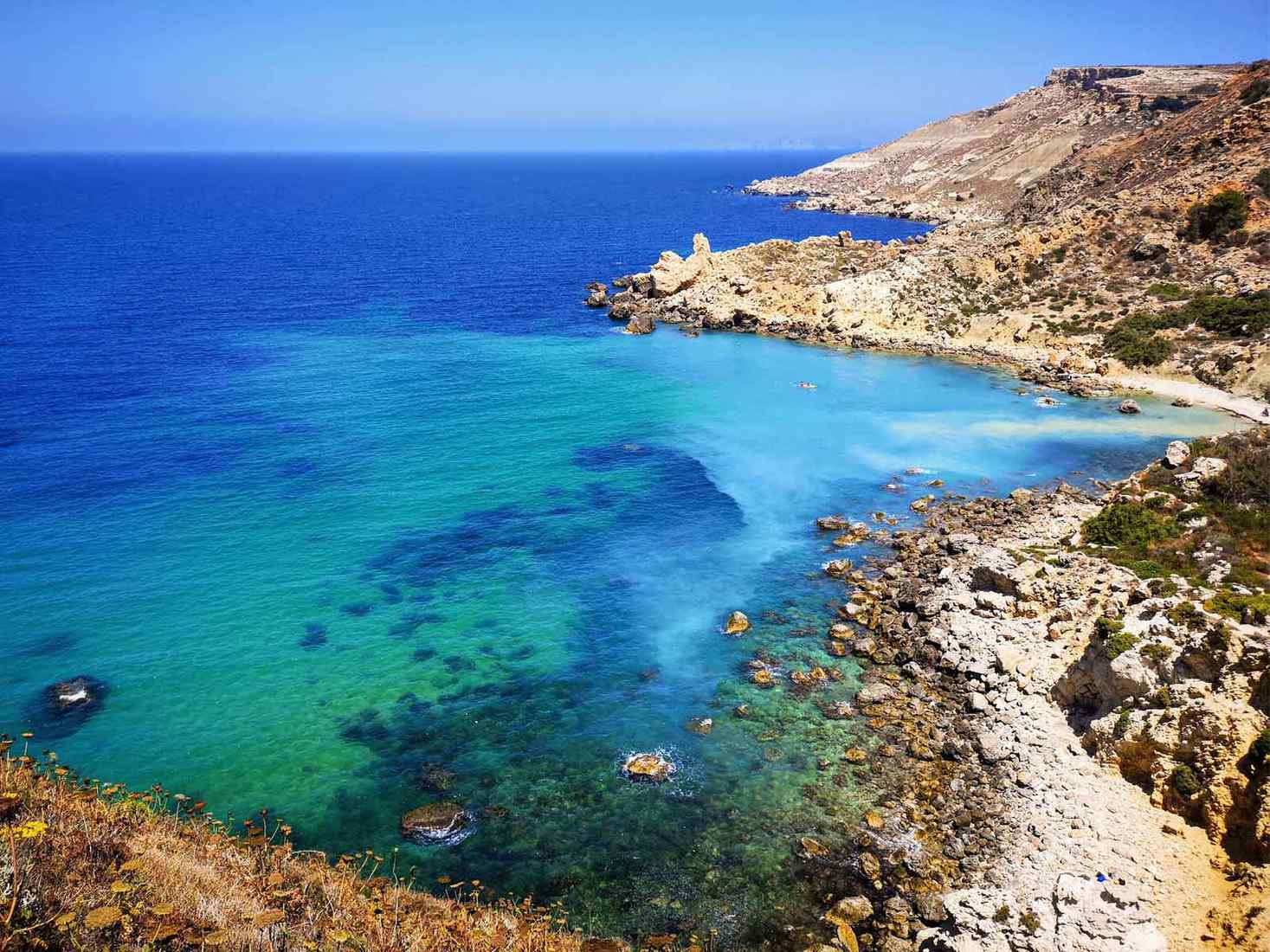 View across the ocean from a rocky bay. 