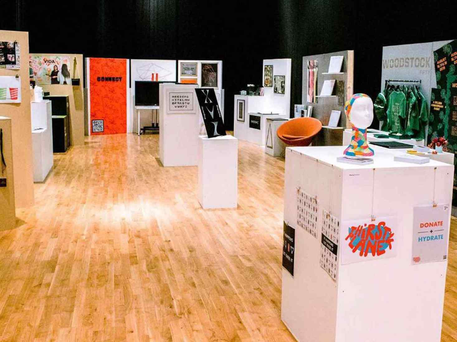 A room filled with student design work 