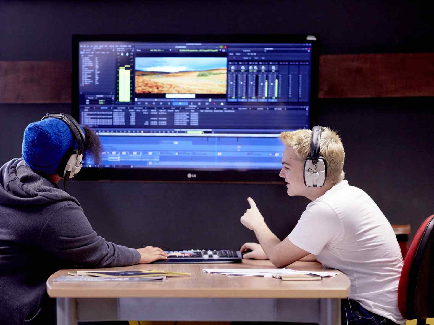 Students working together to edit video 