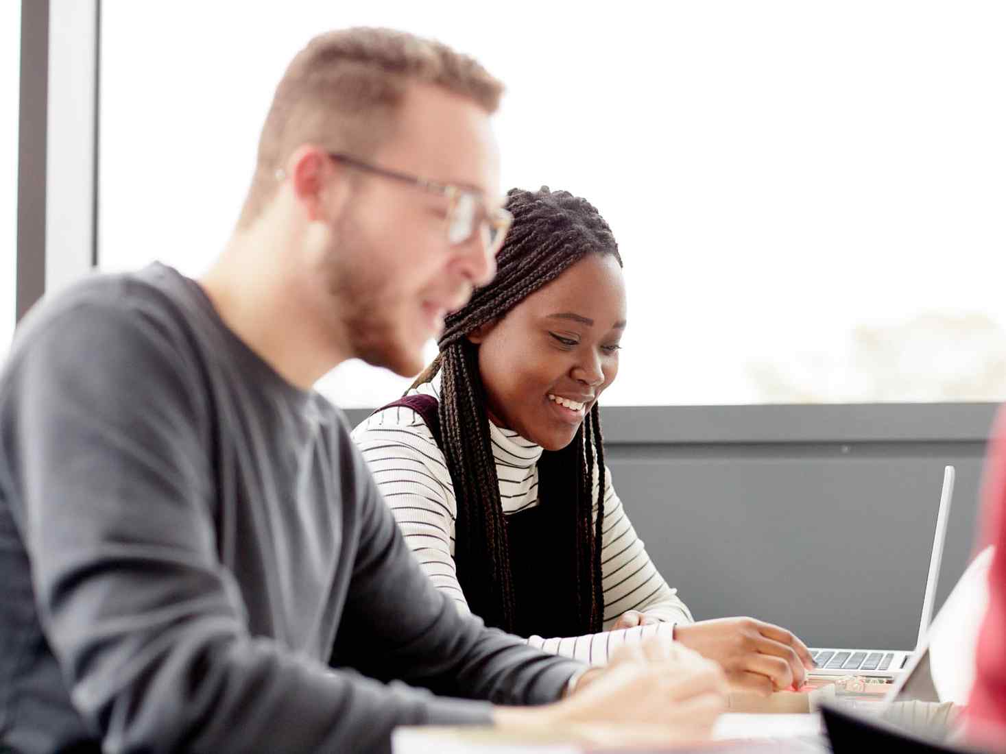 Students working at laptop 