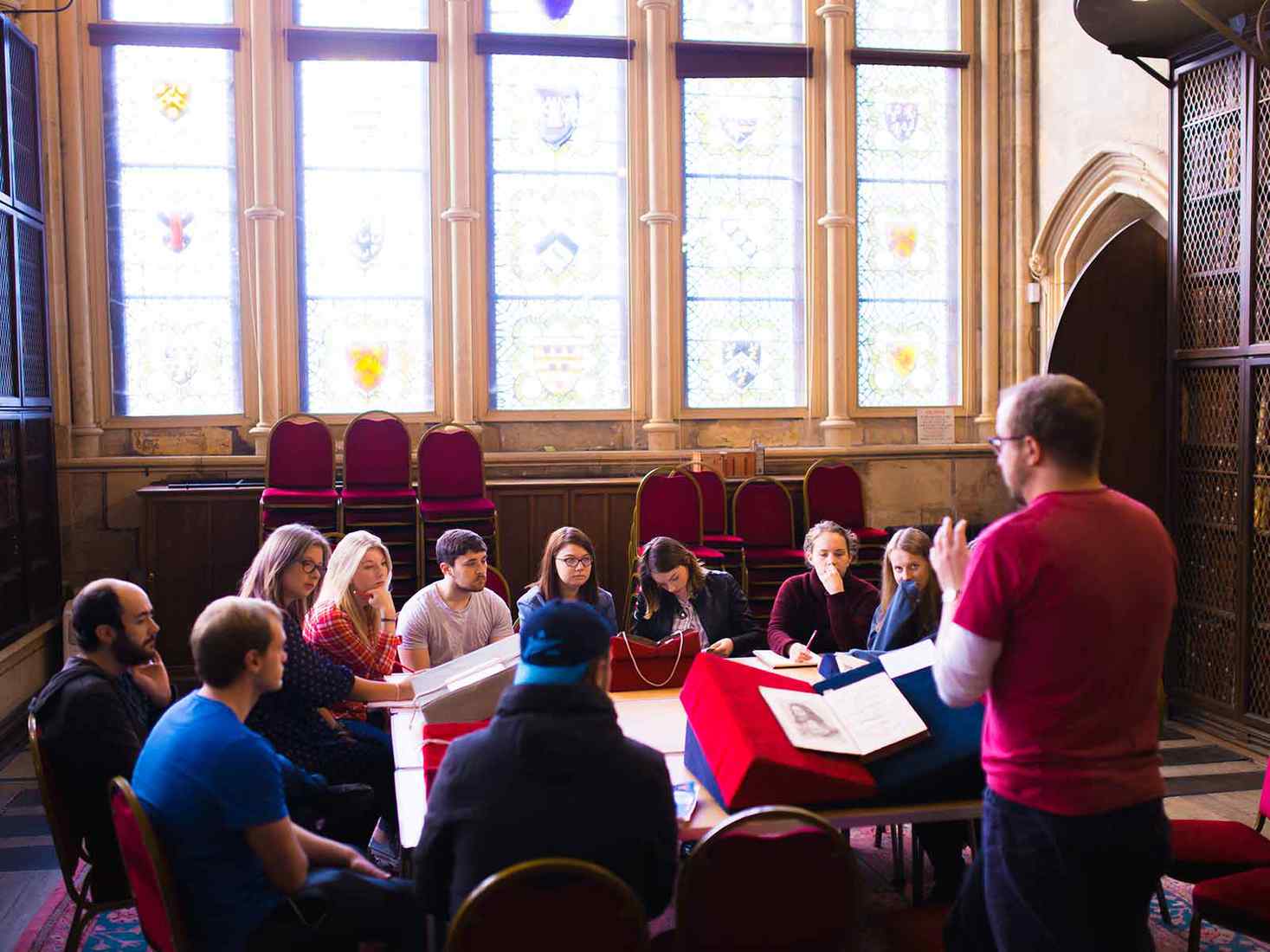 lecturer talking to students at the library 