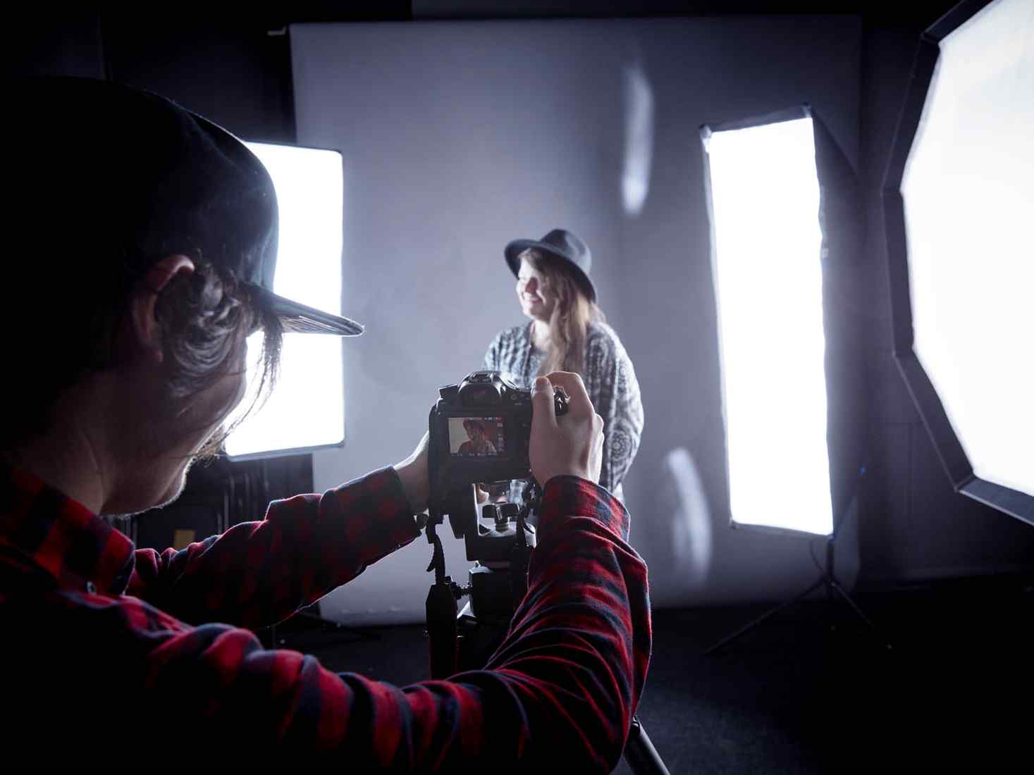 Student taking photo in studio 
