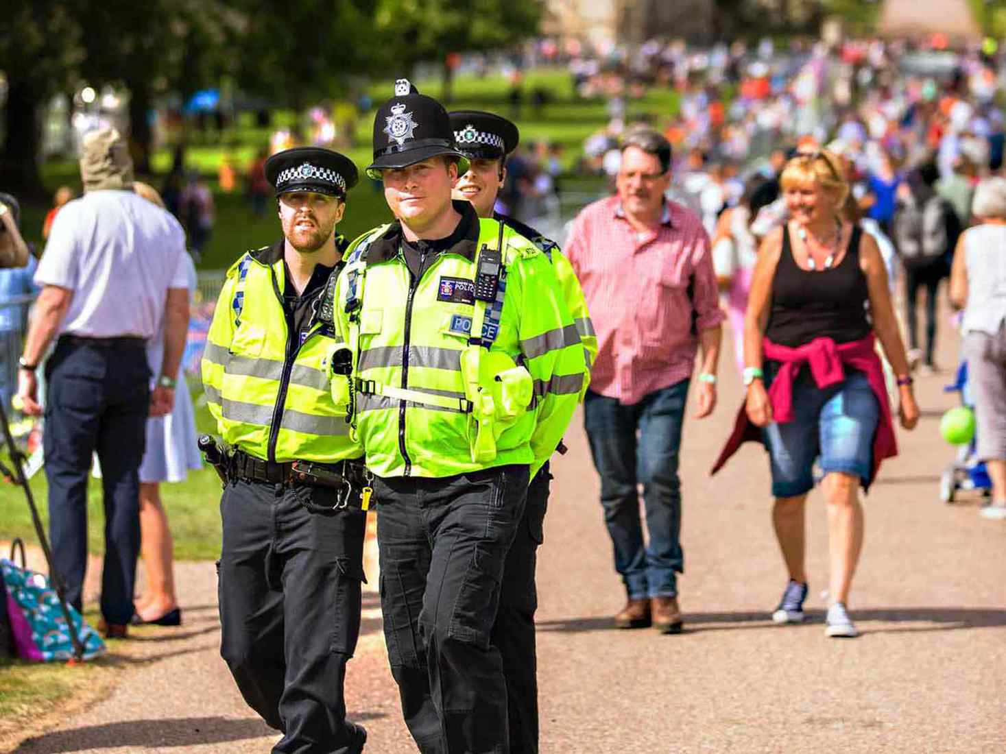 Police officers walking through a town 