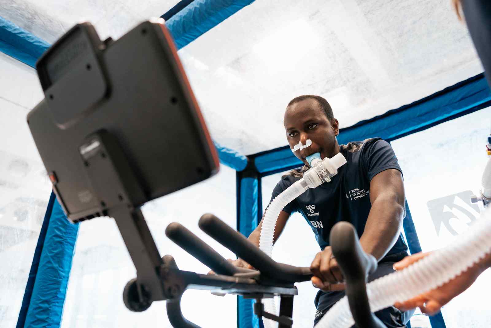Student on bike in chamber 