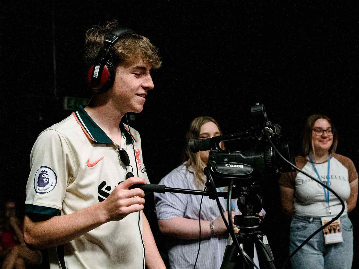 A student at the Discover YSJ summer school operates a camera. 
