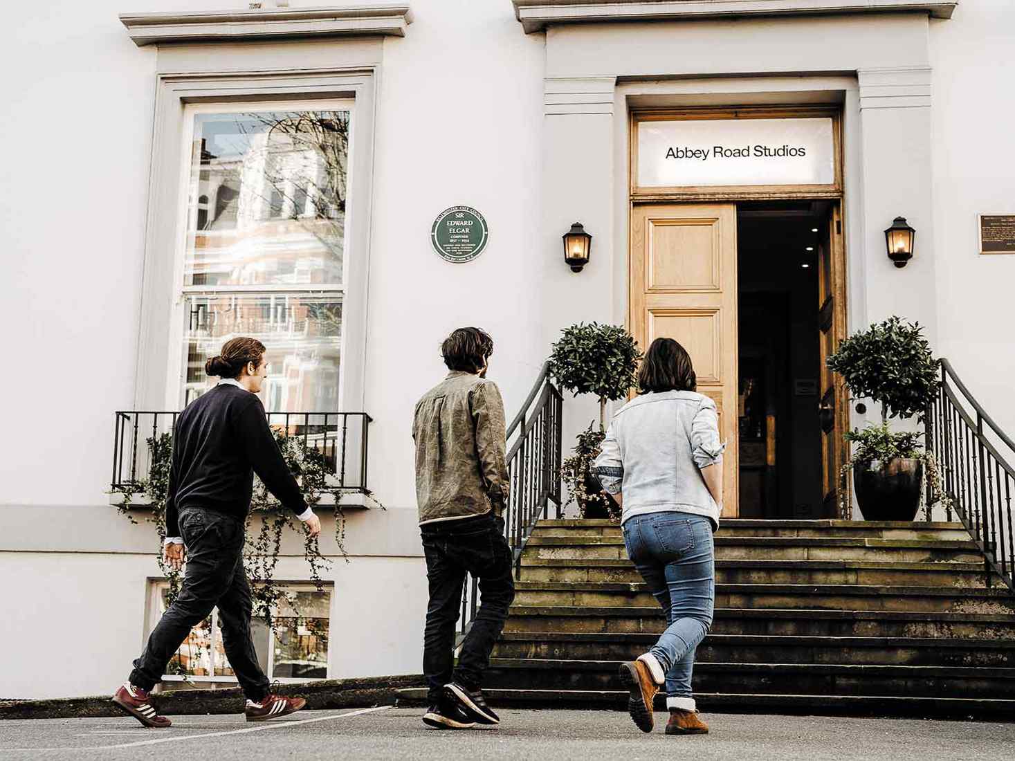 students walking into abbey road studios 