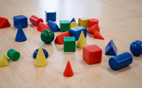 Coloured building blocks on table 