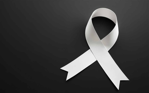 Crossed white ribbon on black background. 