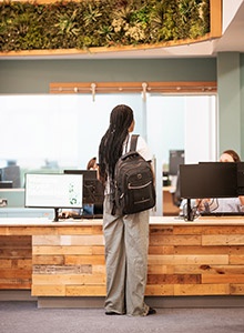 Student asking for support at Student Hub help desk 