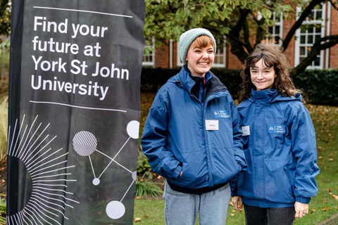 Two Student Ambassadors at an event. 