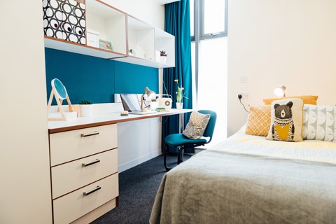 Bed and desk in student accommodation at York St John Central 