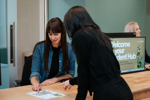 A student being helped at the Student Hub. 