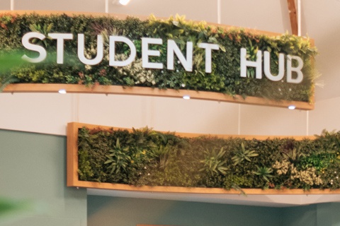The Student Hub sign in the Student Hub at York St John University York Campus. 