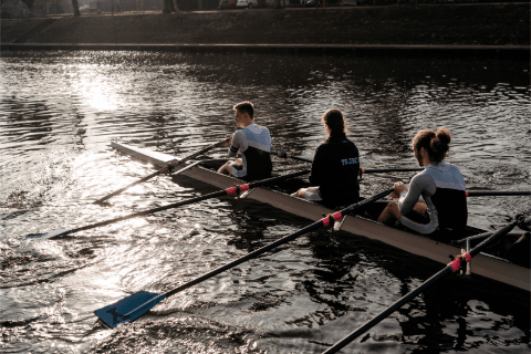 3 students rowing on the river ouse. 