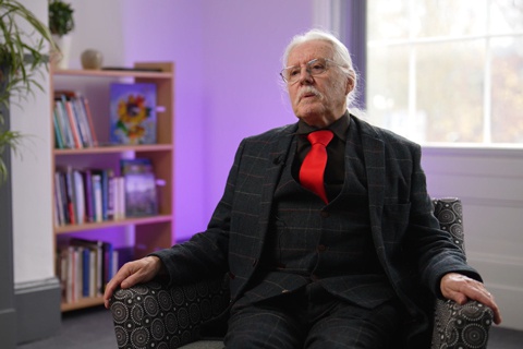 A man sitting in a chair. 