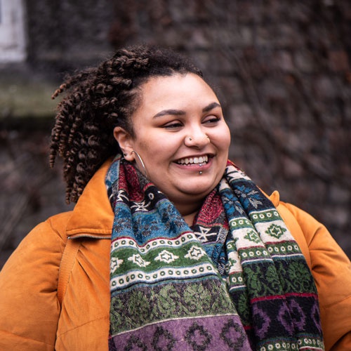 Mature student looking happy on campus 