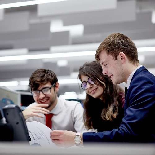 Three business students working 