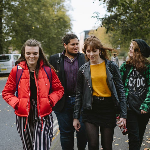 Group of students walking down Lord Mayor's Walk 