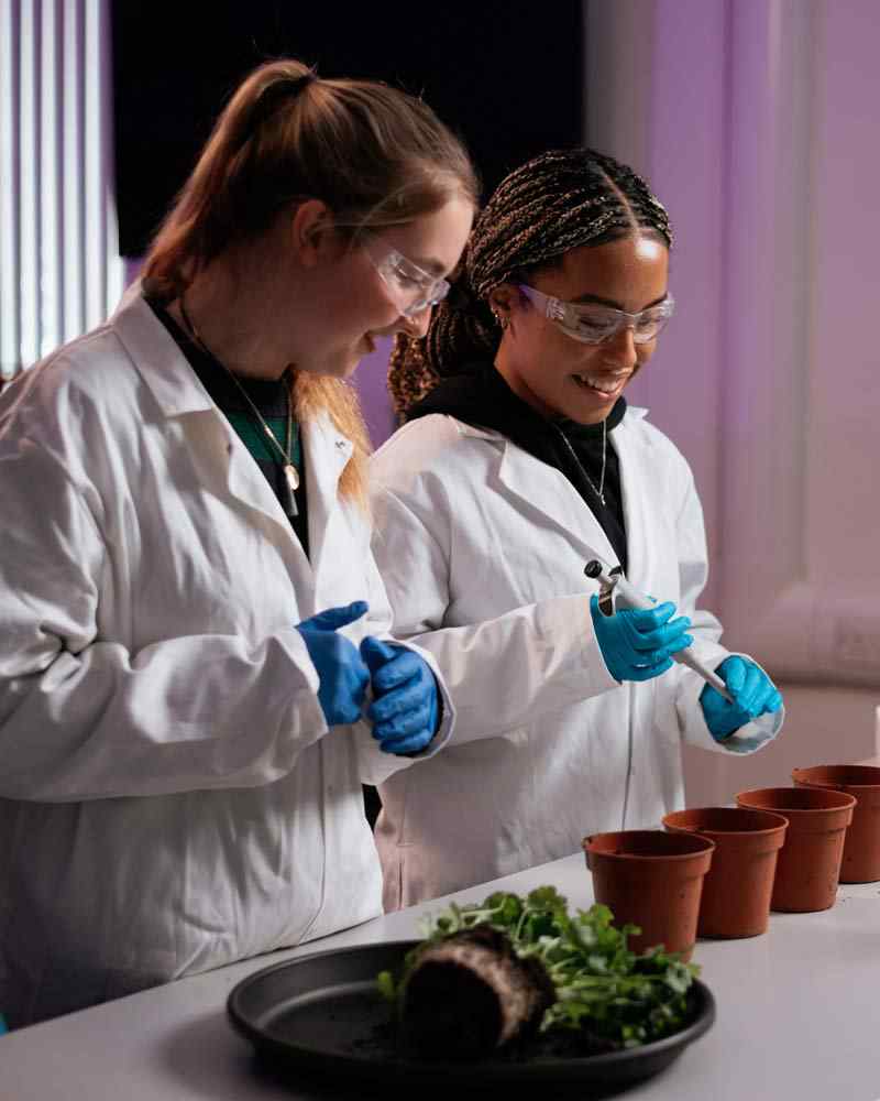 Two students working on an experiment in the geography lab. 